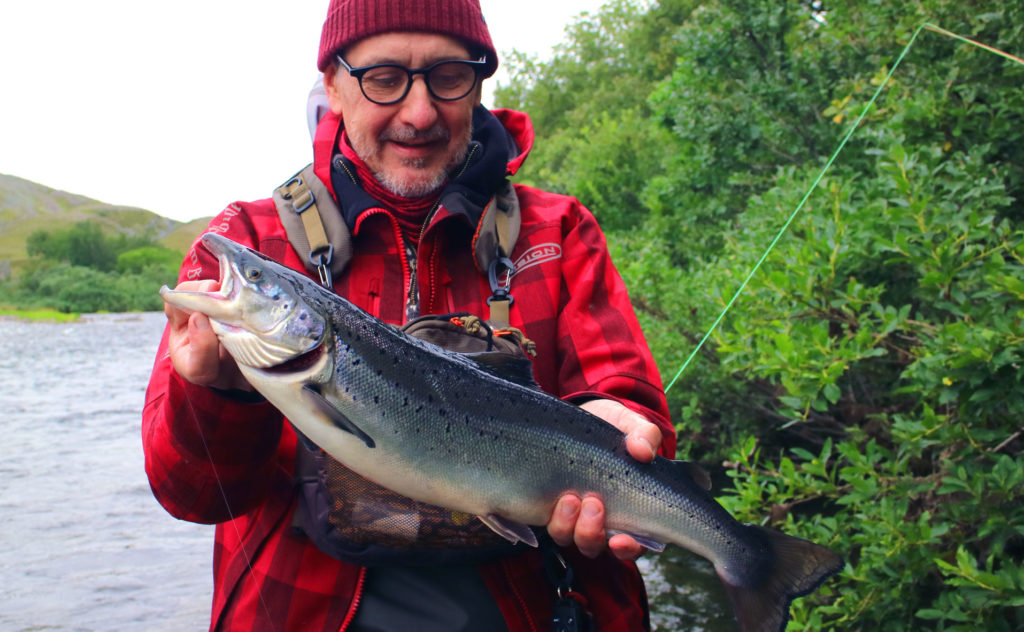 Atlantic Salmon Fly - First catch on dry fly fishing in Norway